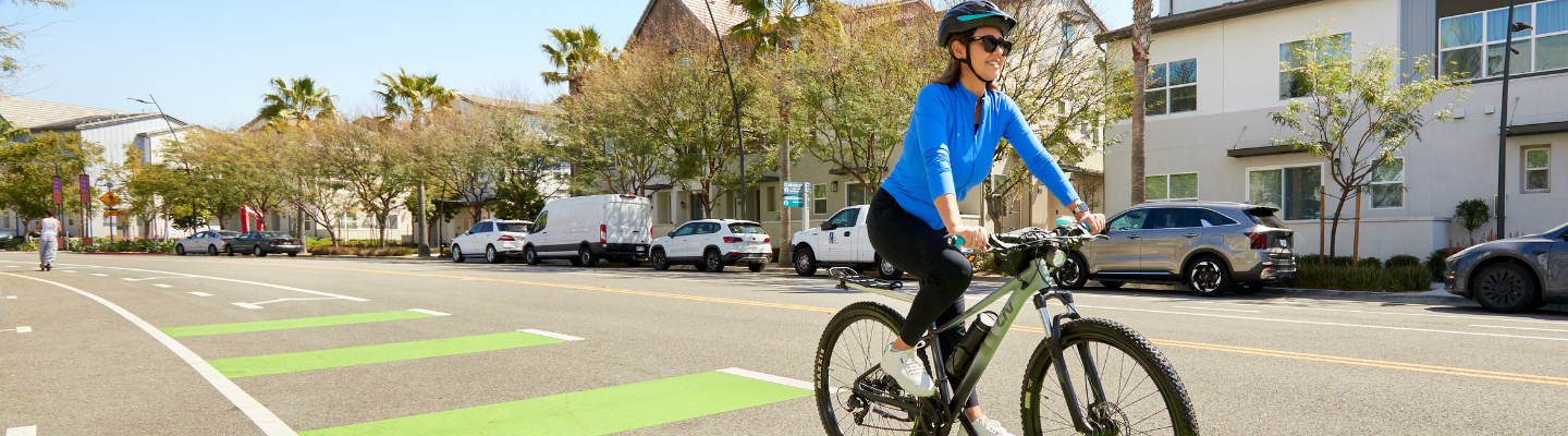 women with helmet riding bike