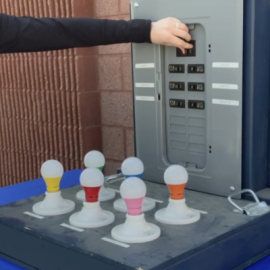 Person demonstrating how to shut off an electrical panel