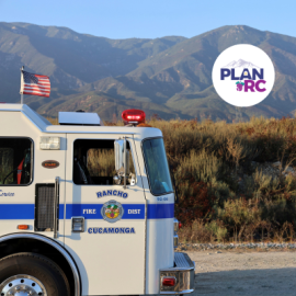 Promotional graphic for the Local Hazard Mitigation Plan. Image shows a Rancho Cucamonga Fire District fire engine parked on a dirt road with mountains in the background under clear daylight. An American flag is mounted on top of the fire engine. A circular PLAN RC logo appears in the upper right corner. Scene suggests community planning or public safety engagement.