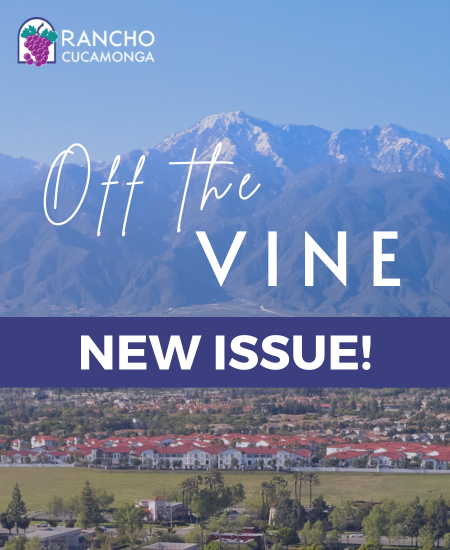 A scenic view of Rancho Cucamonga featuring mountains in the background and a suburban area in the foreground. Text reads "Off the Vine" and "New Issue!" with the city's logo.