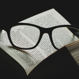 Book with reading glasses