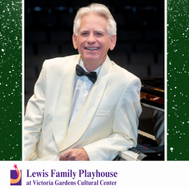 David Benoit wearing a white suit and black bowtie leaning against a piano