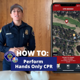 Firefighter demonstrating how to perform hands only CPR